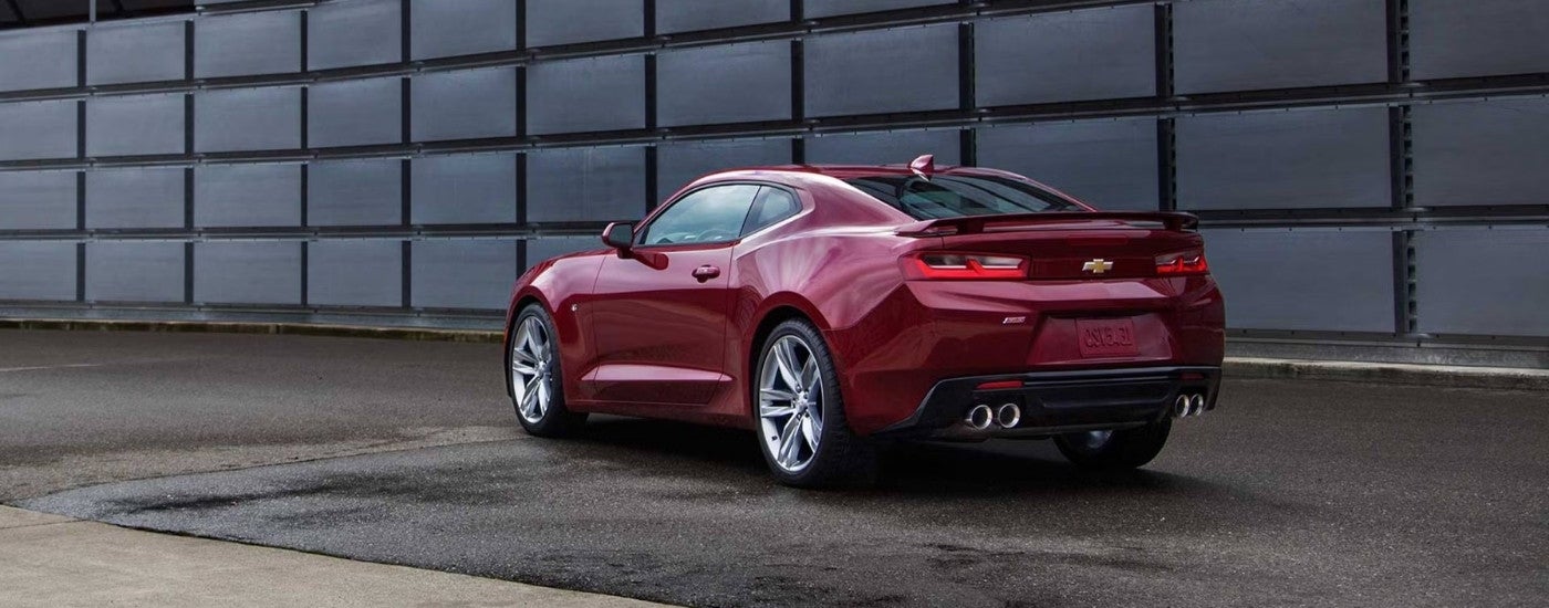 Red 2016 Chevy Camaro SS parked on wet pavement