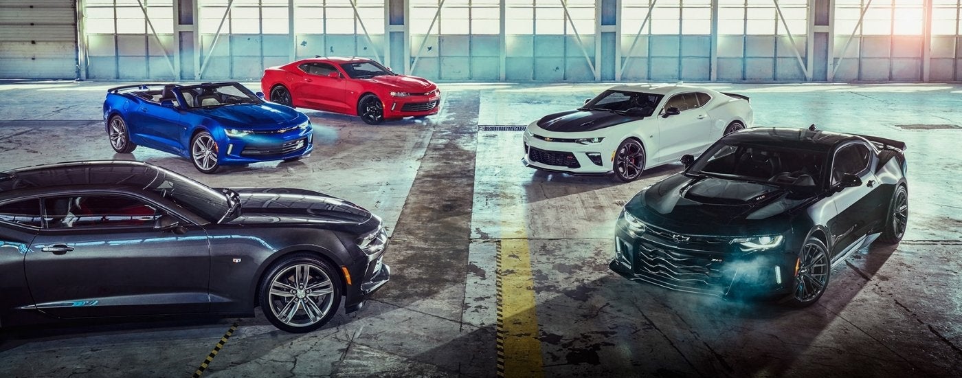 Lineup of 2018 Chevy Camaros parked in a warehouse