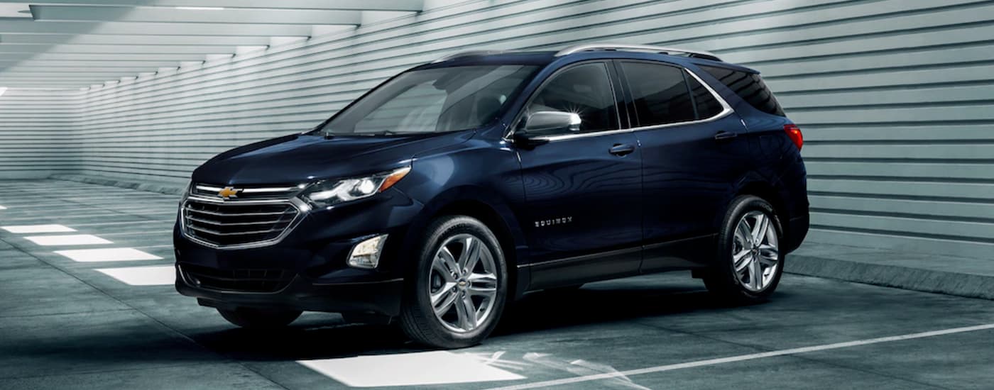 Blue 2020 Chevy Equinox parked in a parking garage.