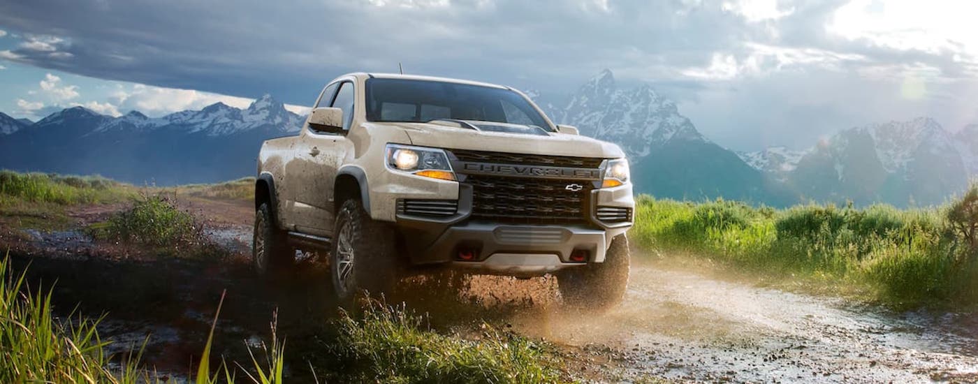 Tan 2021 Chevy Colorado ZR2 driving off-road.
