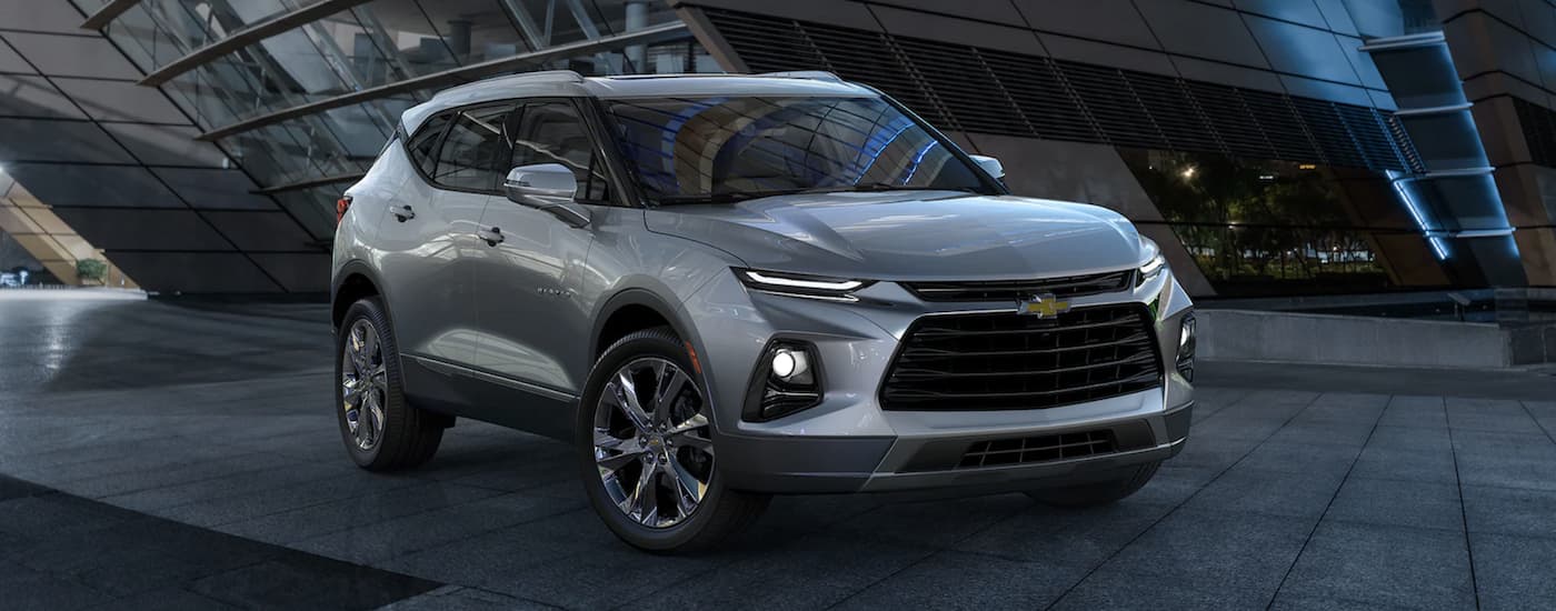 Silver 2022 Chevy Blazer parked near a building.