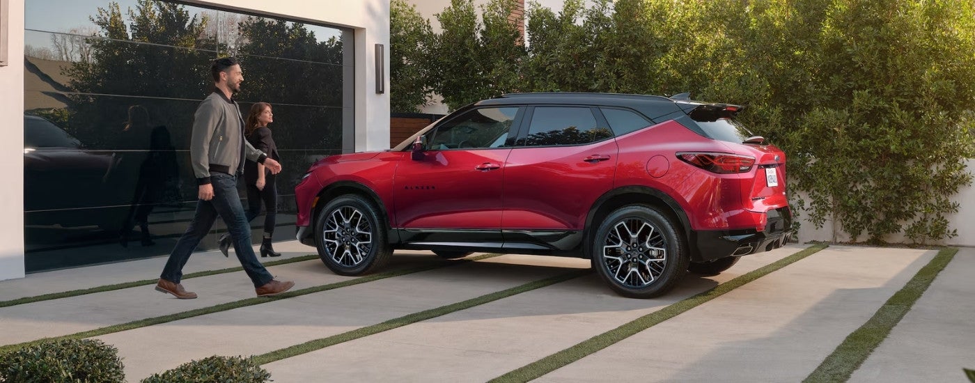 Red 2025 Chevy Blazer parked on a driveway.