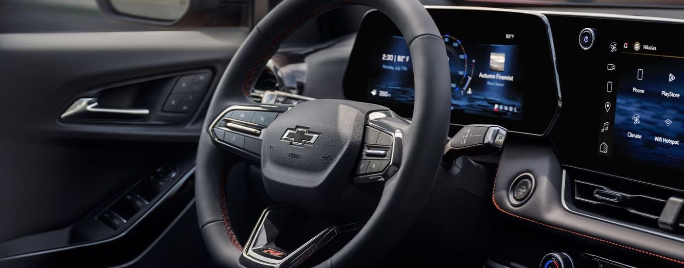 Steering wheel and dashboard inside a 2025 Chevy Equinox RS