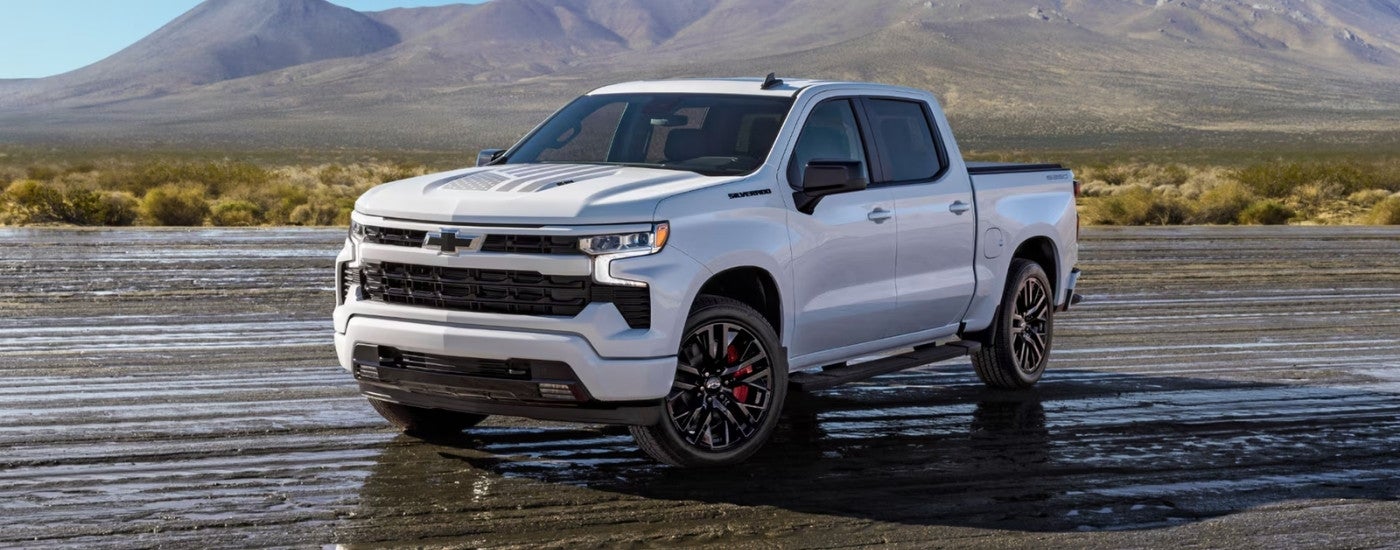 White 2026 Chevy Silverado 1500 RST Stars & Steel Edition parked off-road