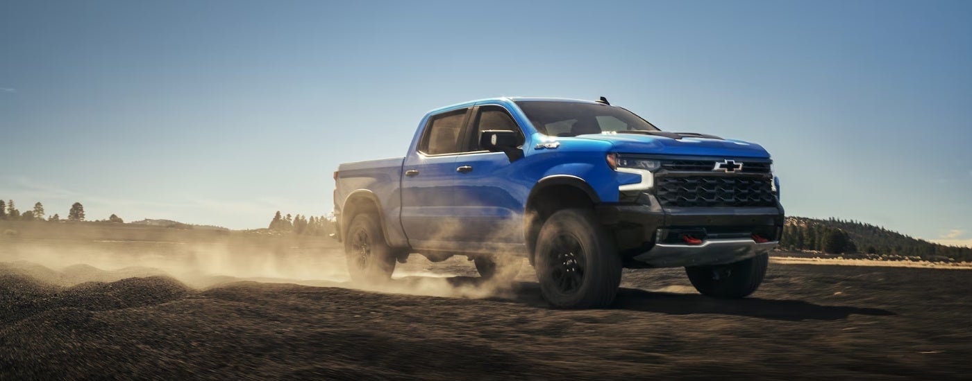 Blue 2026 Chevy Silverado 1500 ZR2 driving off-road