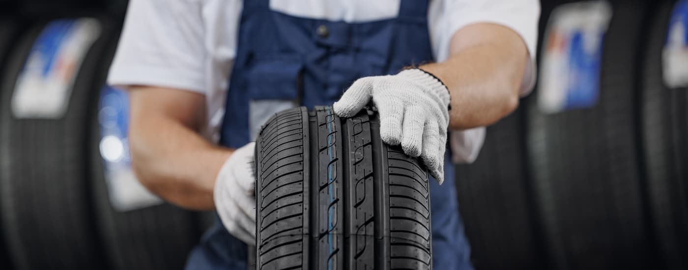 Mechanic holding a tire
